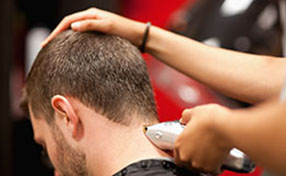 Close Up Of A Male Student Having A Haircut